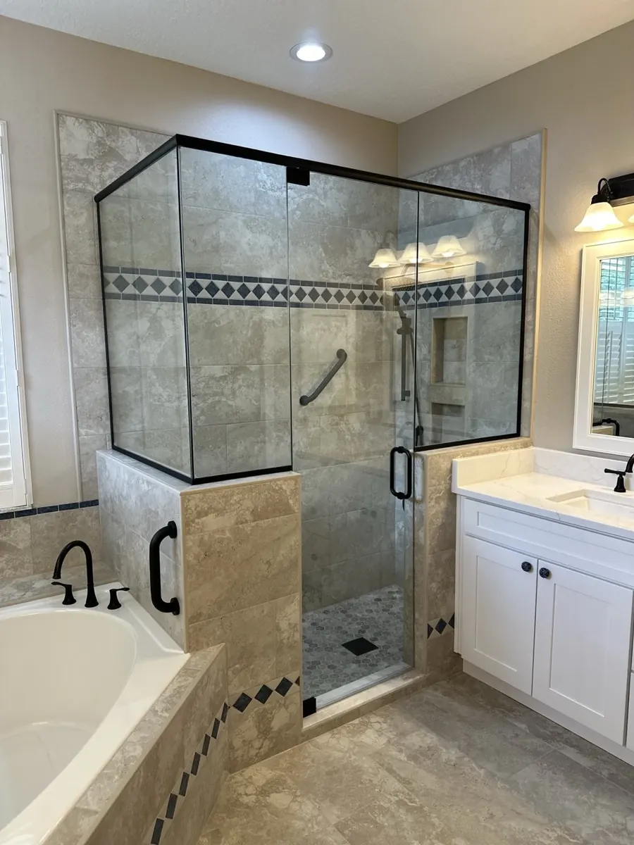 Tile shower with black glass enclosure