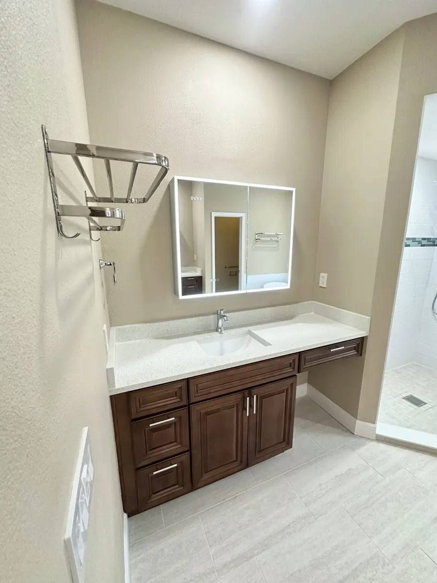 Vanity with illuminated mirror